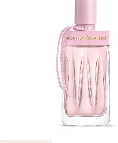 Ljusrosa parfyllflaska med rund lock och guldtext, prydd med en rosa rosett.