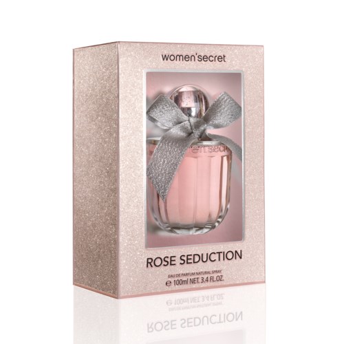 En parfymflaska med rosa vätska, silverband på toppen, i en rosa box märkta 'Rose Seduction', women's secret.