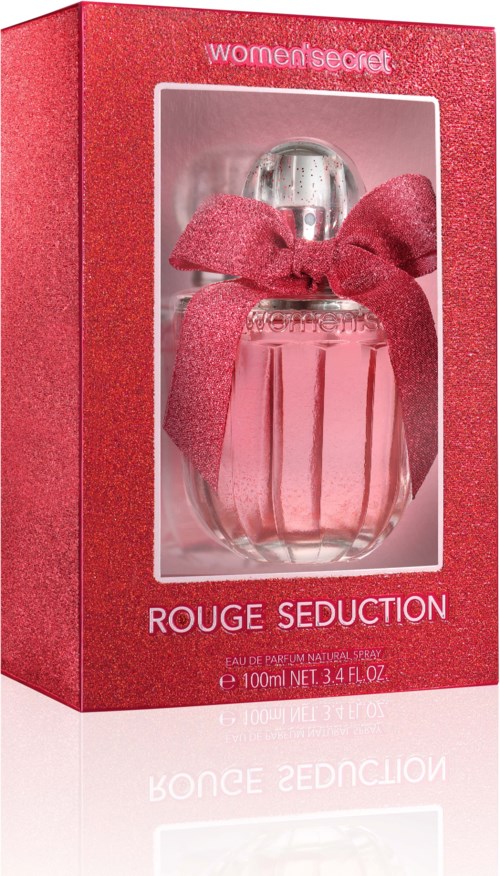 Parfyymipullo laatikossa, jossa vaaleanpunainen rusetti, nimeltä 'Rouge Seduction' Women Secretistä.