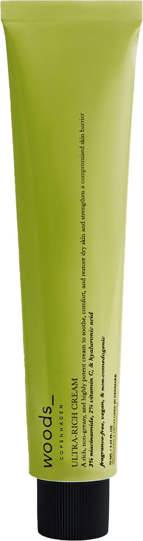 Groene tube met zwarte dop, bevat een product genaamd 'Woods' voor na scheren of haarverwijdering.