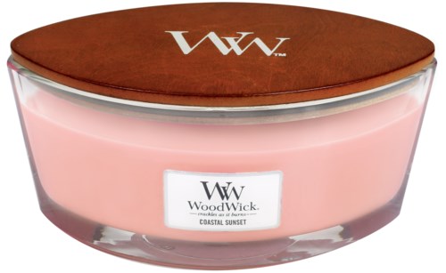 A pink candle in a glass jar with a wooden lid, labeled 'WoodWick Coastal Sunset' and the brand logo.