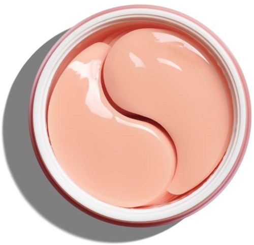 Creamy, light pink skincare product in a jar with a smooth surface and slight reflection.