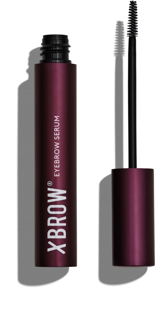 En mørk lilla tube med brynserum og en åben børste med to sider.
