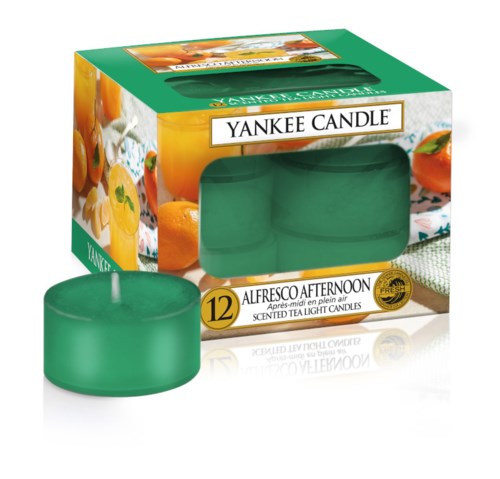 En box med 12 Yankee Candle tealylyktor i grön färg med frukt- och blomdoft.