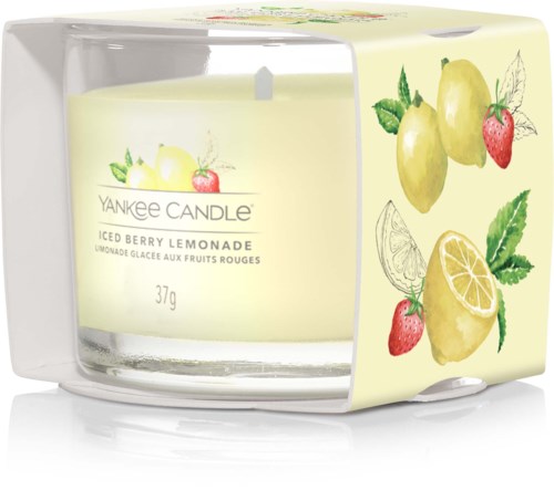 En Yankee Candle i ett skydd, smak av citron och bär, med illustrationer av citroner, jordgubbar och blad.