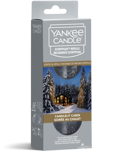 Yankee Candle ScentPlug refill box med en vinterstuga och träd på den.