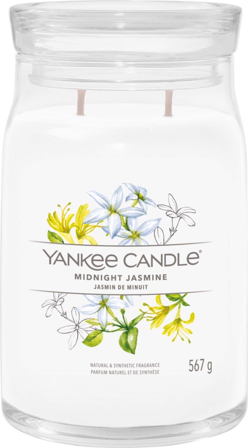 Biały słoik świecy z żółtymi i niebieskimi kwiatami, oznaczony "Yankee Candle Midnight Jasmine", waży 567 gramów.