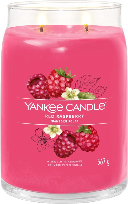 Różowa świeca Yankee Candle z dwoma wypalonymi knotami, ozdobiona malinami, kwiatami i liśćmi, zapach to czerwone maliny.