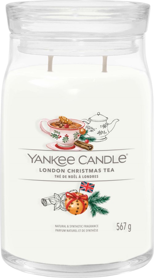 Yankee Candle jar with Christmas tea scent, white wax, festive decorations, and weight of 567 grams.