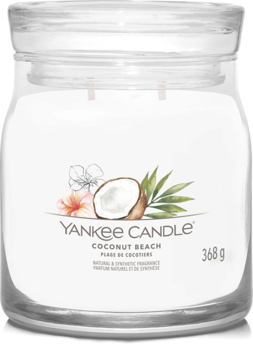 Przezroczysty szklany słoik z zapalniczką kokosową i tropikalnymi kwiatami, oznaczony 'Yankee Candle Coconut Beach,' waży 368g.