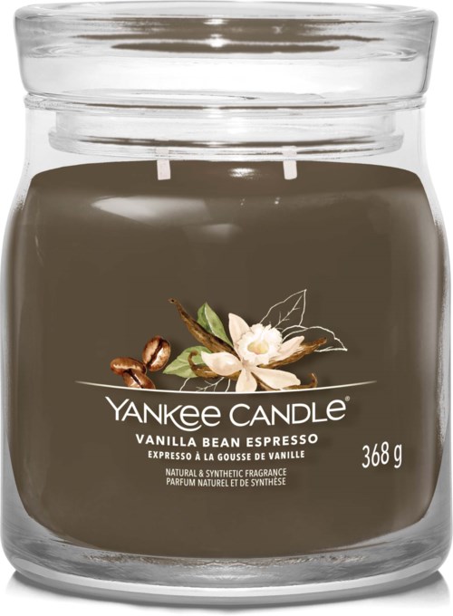 Ett mörkbrunt Yankee Candle-glas med vaniljbönsblommor på etiketten, som väger 368 gram.