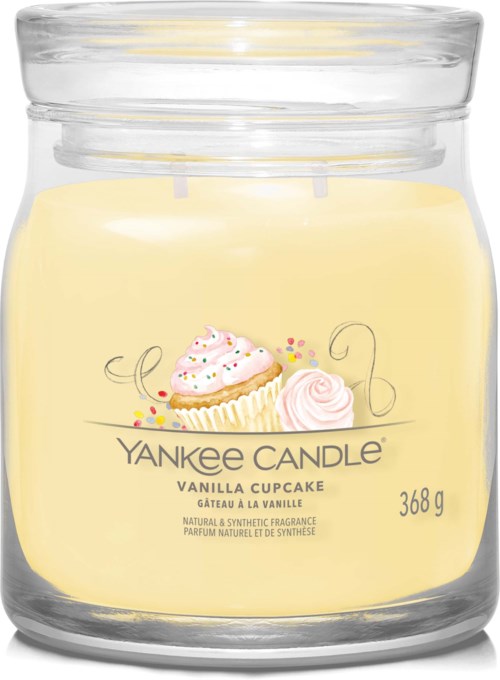 Een vanillegeurkaars in een glazen pot met cupcake-design en pastelkleuren.