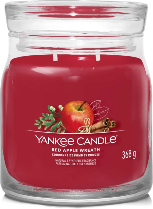 Röd ljus med äpple och kanel på etiketten, märkt 'Yankee Candle Red Apple Wreath,' väger 368 gram.