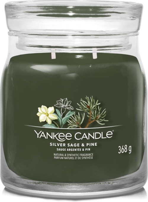 Green candle in a glass jar with white flowers and pine branch illustrations, labeled 'Yankee Candle Silver Sage & Pine' with weight 368g.