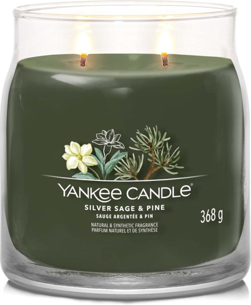 Green candle with pine and sage illustration, Yankee Candle logo, 368 g weight, lit wicks close together.