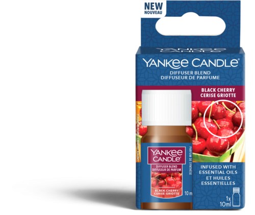 En liten flaska Yankee Candle körsbärs luftfräschare i blå förpackning med körsbärsbilder.