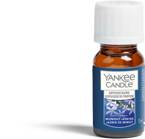 A small brown bottle with a white cap and a blue label that says "Yankee Candle" and "Midnight Jasmine."