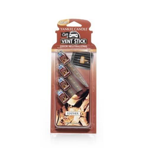 A Yankee Candle vent stick air freshener with leather scent, including small scent tabs and a vent clip.