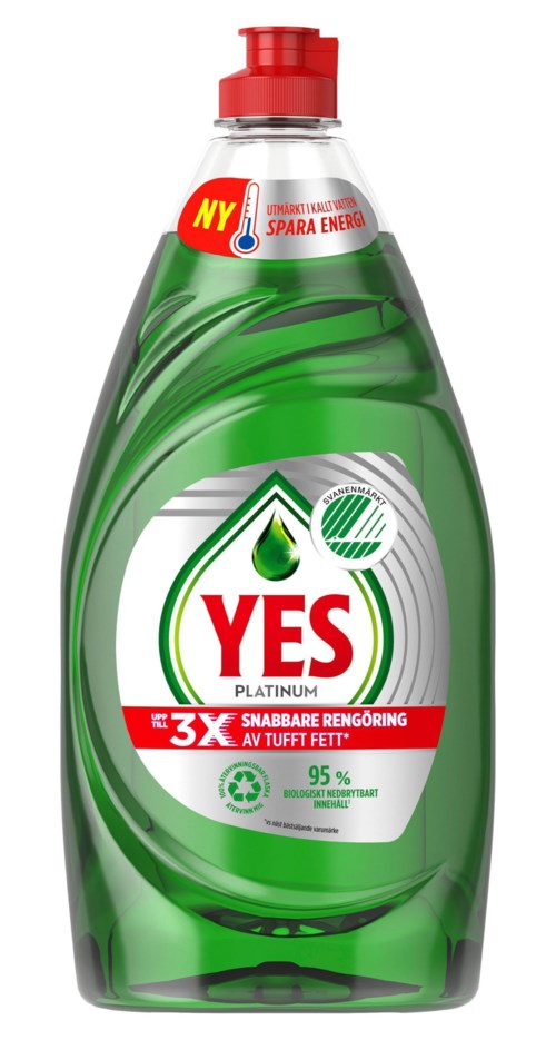 Eine grüne Spülmittel-Flasche mit rotem Deckel, beschriftet 'YES' und 'Platinum,' mit einem Blatt und Wassertropfen.