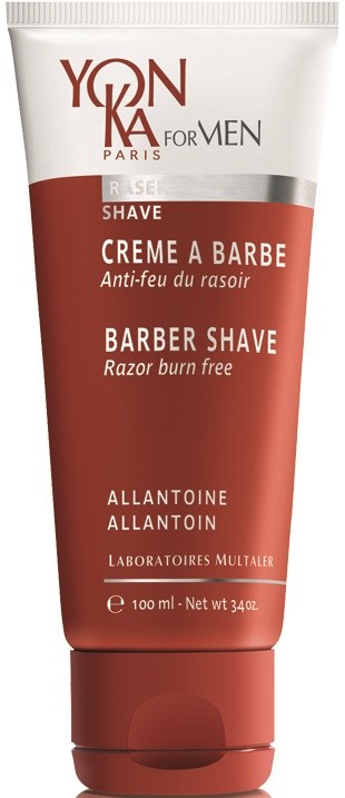 Röd och vit tub med rakkräm för barberare med text på flera språk.