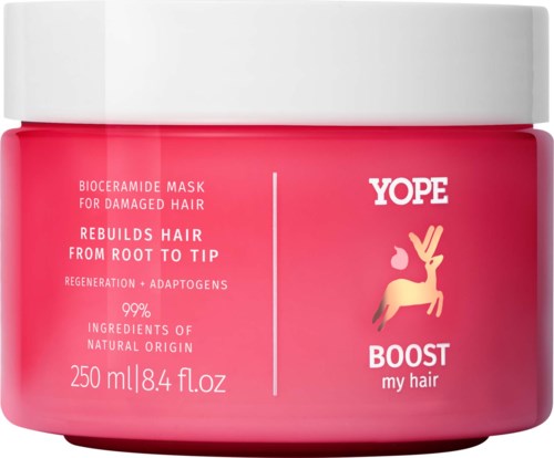 En rosa krukke med YOPE Boost hårmaske for skadet hår, inneholder naturlige ingredienser, med hvit lokk og merkevarelogo.