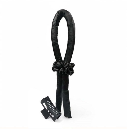 En svart rem med rosett och ett litet svart pedal, möjligen en del av en säkerhets- eller fitnessutrustning.