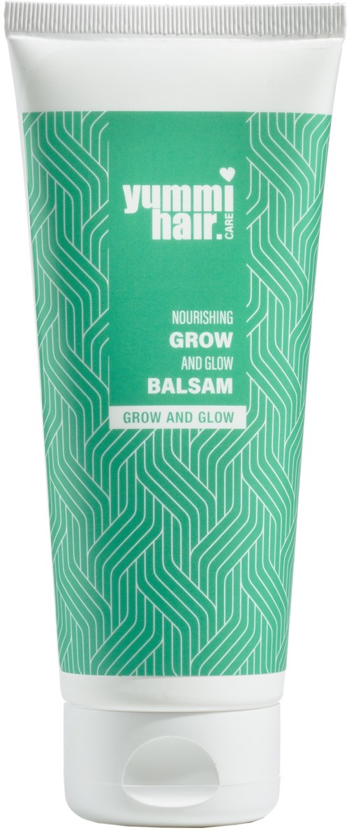 En tube med grønn og hvit design, merket 'Yummi Hair' nærende vekst- og glansbalsam.