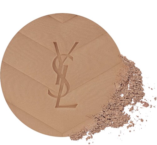 Puderdosa med Yves Saint Laurent-logotypen, lite puder spilled ut.