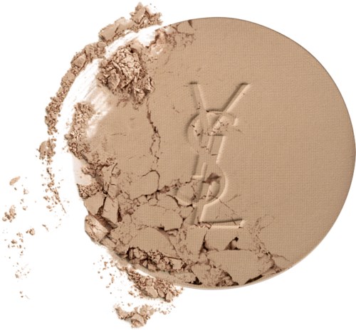 A pressed powder with a logo, shattered and scattered around, showing a beige shade.