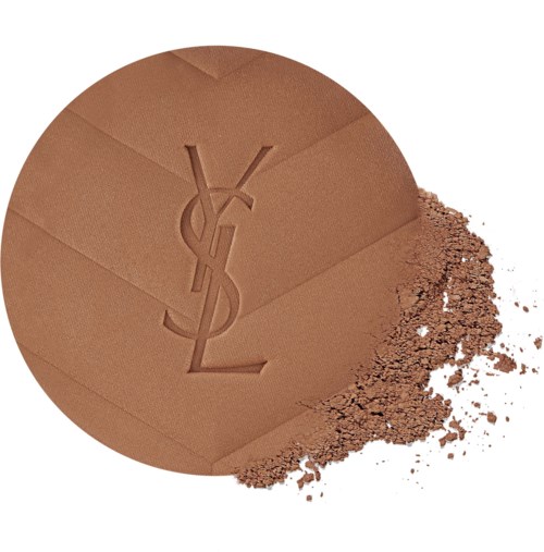 Yves Saint Laurent logo pressed into brown powder with some powder spilled outside.