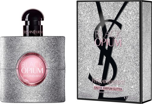 A perfume bottle and box, both glittery silver with pink and black accents, for Black Opium Yves Saint Laurent.