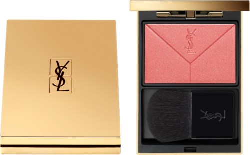 A blush compact with a brush, featuring a pink blush and a gold and black case with YSL logo.