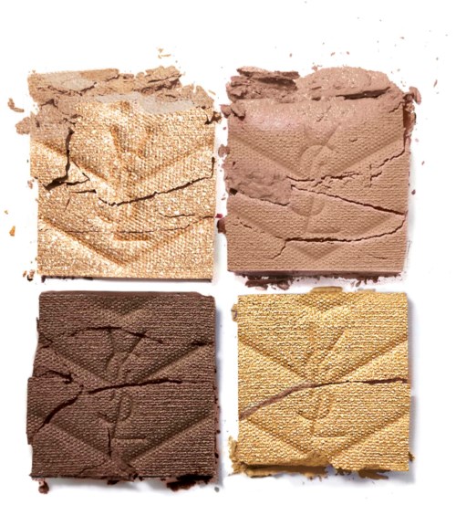Vier gekneusde oogschaduw in verschillende tinten: beige, roze, donkerbruin en goud.