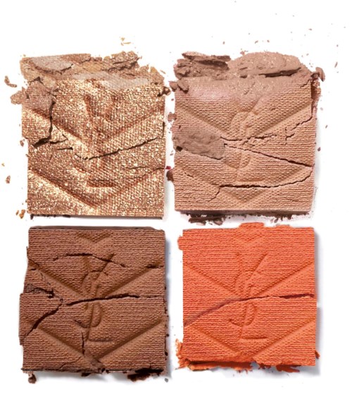 Vier vierkante stukjes make-up poeder: glanzend goud, lichtbruin, donkerbruin en oranje, alle gebroken.