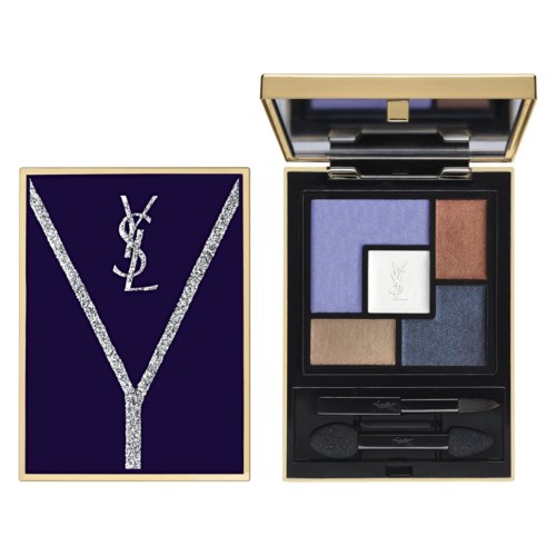 A makeup palette with four colored powders and a mirror, next to a YSL logo decorated with silver glitter.