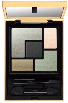 A cosmetic palette with five different shades of eyeshadow in a black and gold case.