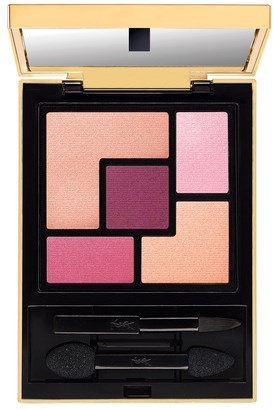 A makeup palette with pink, purple, and peach shades, including brushes and applicators inside a black case.