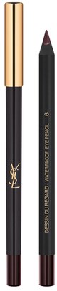 En guld- och svart makeuppenna med Yves Saint Laurent-ändamärke, står upprätt.