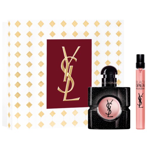 Yves Saint Laurent-logo med et utvalg av makeupprodukter, inkludert en rosa leppepomade og en liten parfymeflaske.