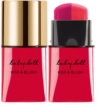 Läppstift i pink nyans, guldkapsel, svart band, märkt 'babydoll KISS & BLUSH'.