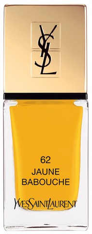 Et YSL leppestiftsrør med gullhette og gjennomsiktig flaske som viser gult leppestift, merket '62 Jaune Babouche'.