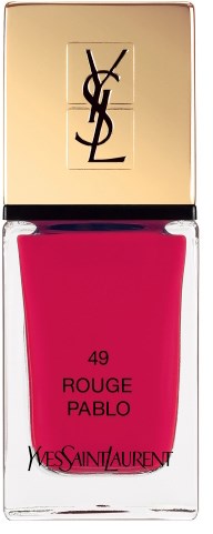 En YSL leppglansflask med gullkapsel og fargerikt rosa gloss innvendig.