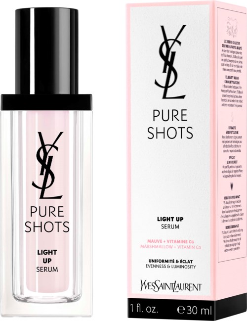 YSL Pure Shots Light Up Serum -pullon edessä pinkin laatikon edessä, merkintä tuotteesta ja yksityiskohdista.