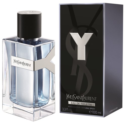 A perfume bottle and box with Yves Saint Laurent branding, black cap, clear liquid, and modern design.