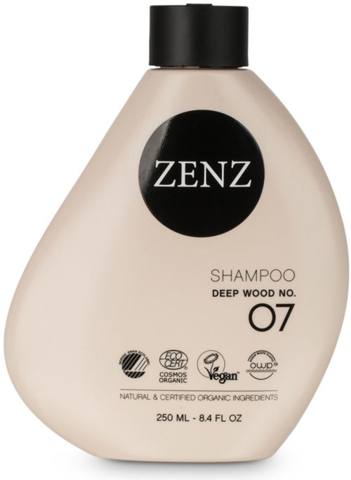 En beige schampoflaska med svart lock, märkt ZENZ, Deep Wood No. 07, och olika ekocertifieringssymboler.