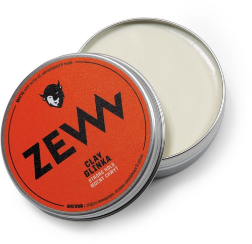 Zeww leirevoks med svart ulv logo, oransje etikett, åpen boks, hvit voks inni.