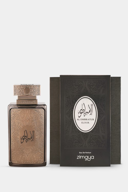 Een parfumfles met decoratieve dop en een zwarte doos met Arabische tekst en logo.