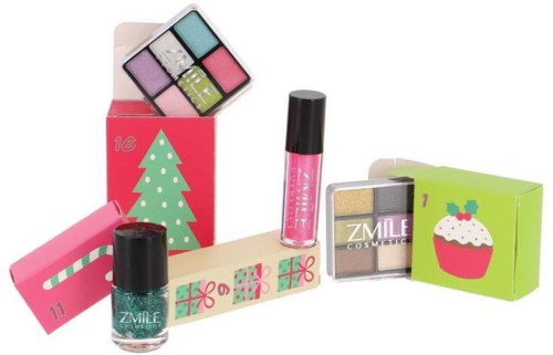 Julinspirerad makeup-sets med nagellack, läppglans, ögonskuggor och en liten presentask.