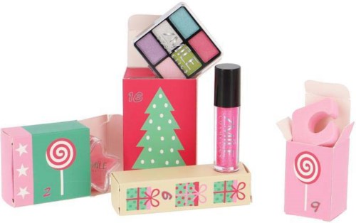 Färgglada smink- och presentaskar, inklusive läppstift och ögonskuggspalett. Jultema med dekorerad box.