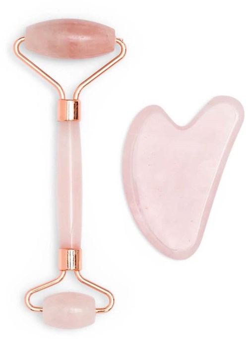 Rosa jade roller ja gua sha -työkalu, molemmat käytetään ihonhoitoon ja kasvojen hierontaan.